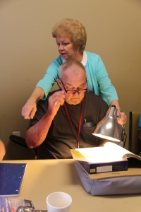 Vision Rehabilitation Teacher Jane Bush demonstrates how bright lighting can boost contrast and magnification and make a profound difference for someone who has low vision.